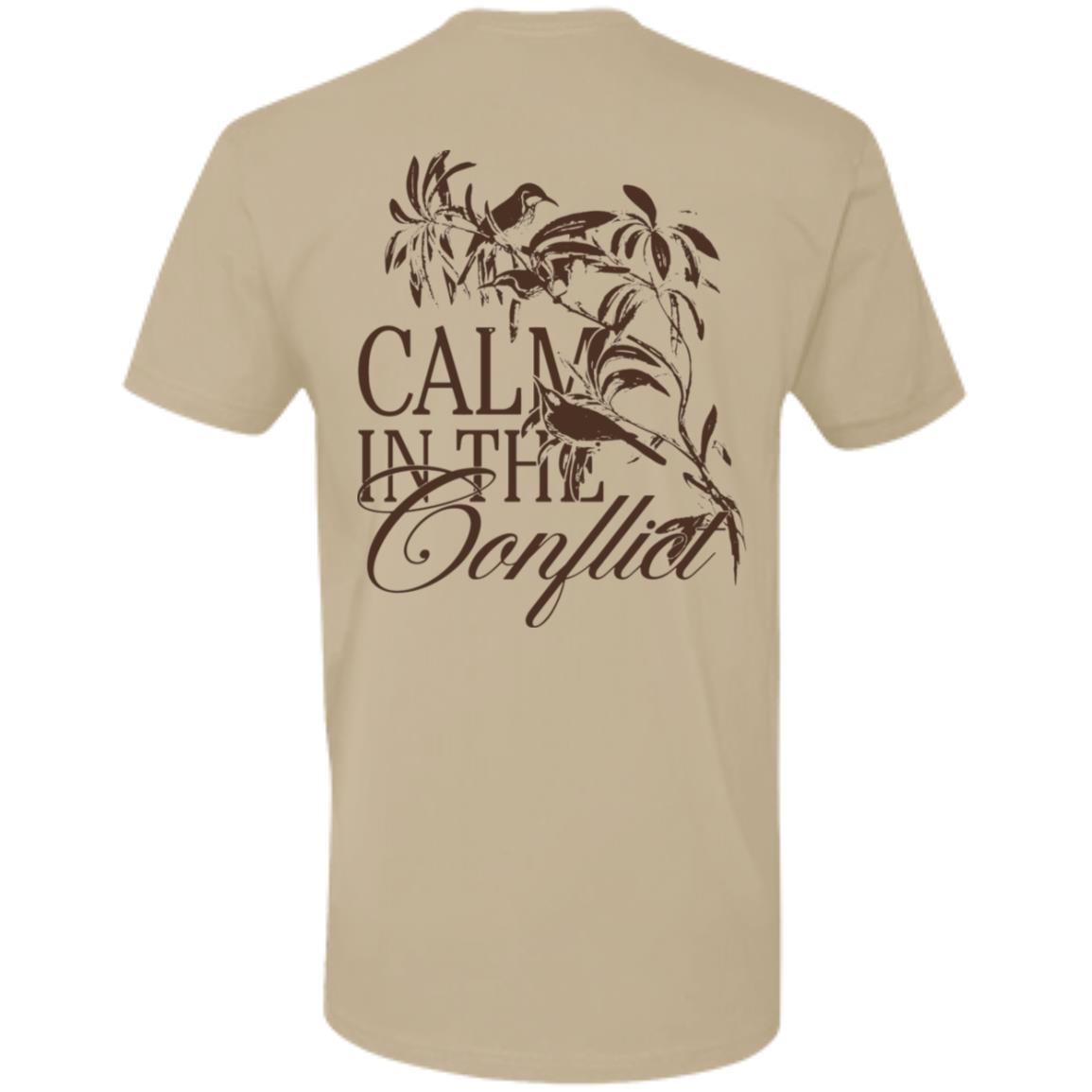 The Calm In The Conflict - Sand tee, crafted from premium ring-spun cotton in a soothing beige shade, showcases the phrase "Calm in the Conflict" along with an artful depiction of a bird and branches on the back. Embrace serenity amidst turmoil with this beautifully designed t-shirt.