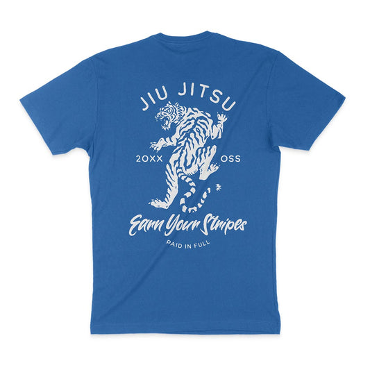 A blue T-shirt featuring a graphic of a tiger, with the text "JIU JITSU" at the top, "20XX OSS" in the middle, and "Earn Your Stripes PAID IN FULL" at the bottom to remind you to earn your stripes every day. The product name is Earn Your Stripes - Royal.