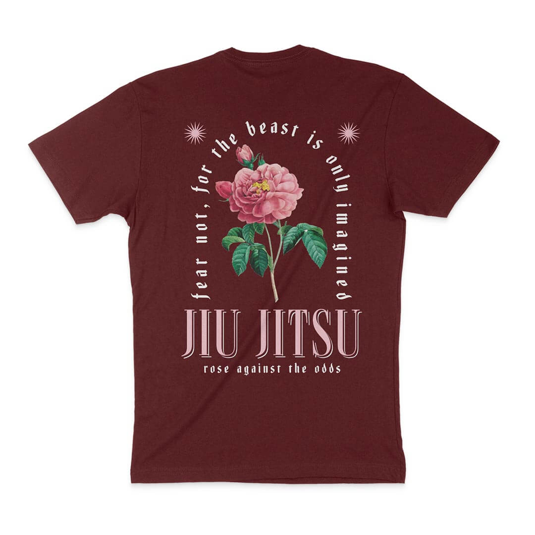 Product description: **The Beast Is Only Imagined - Maroon** featuring a large pink flower graphic. The text reads "Fear not, for the beast is only imagined. Jiu Jitsu. Rose against the odds.